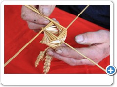 Bert Manton making corn dollies, he teaches this craft which goes back thousands of years. Working in his workshop at Woodford Halse in Northamptonshire ( 3 in a set )